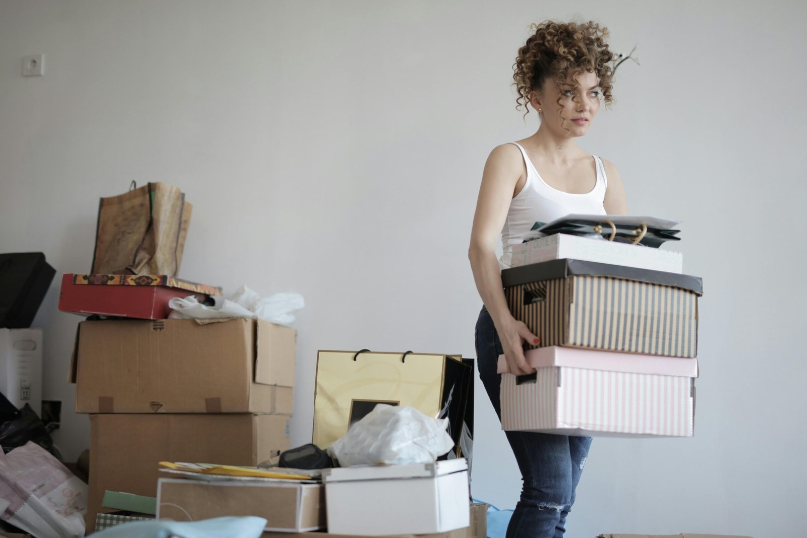 woman moving multiple boxes