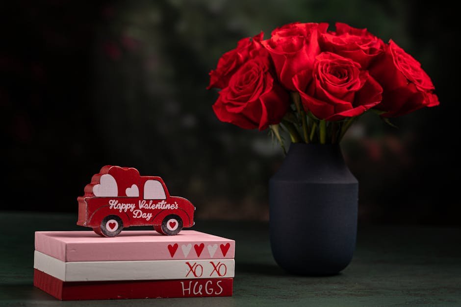 Elegant bouquet of red roses in a dark vase with a romantic Valentine's gift setup.