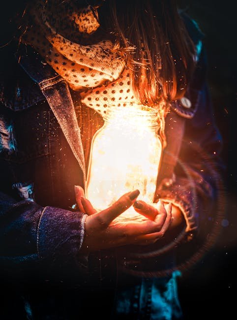 Artistic portrait of a woman holding a glowing jar, creating a magical light effect against a dark background.